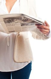 Woman holding a newspaper