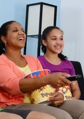 Mom and daughter enjoy movie night